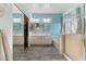 Bright bathroom featuring double vanity sinks, a glass shower, and a fresh, clean aesthetic at 1924 S Rome St, Gilbert, AZ 85295