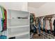 Walk-in closet offering ample storage space with built-in shelves and rods for organization at 1924 S Rome St, Gilbert, AZ 85295