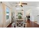 Dining room with a wooden table and chairs with bench seating at 1924 S Rome St, Gilbert, AZ 85295