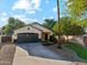 Well maintained home with desert landscaping, two car garage and long driveway at 1924 S Rome St, Gilbert, AZ 85295