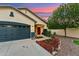 Inviting home featuring a well-manicured front yard with mulch and rock landscaping at 1924 S Rome St, Gilbert, AZ 85295