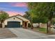 Charming single-story home with a well-maintained yard, two car garage, and inviting entryway at 1924 S Rome St, Gilbert, AZ 85295
