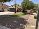 Landscaped front yard of a single Gathering house, with mature trees and curb appeal at 1924 S Rome St, Gilbert, AZ 85295