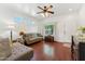 Cozy living room with hardwood floors, neutral paint, and a view of the front yard at 1924 S Rome St, Gilbert, AZ 85295