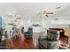 Open-concept space with hardwood floors connecting the living and dining areas at 1924 S Rome St, Gilbert, AZ 85295