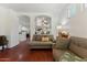 Inviting living room featuring hardwood floors, neutral paint, and arched doorways at 1924 S Rome St, Gilbert, AZ 85295