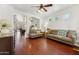 Bright and airy living room featuring hardwood floors and large windows at 1924 S Rome St, Gilbert, AZ 85295