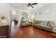 Bright and airy living room with hardwood floors, neutral paint, and ample seating at 1924 S Rome St, Gilbert, AZ 85295