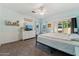 Airy bedroom with a ceiling fan, slider door access, and a large closet for convenience at 1924 S Rome St, Gilbert, AZ 85295