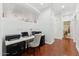 Bright home office features a sleek desk with marble top and rich wood flooring at 1924 S Rome St, Gilbert, AZ 85295