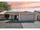Charming single-story home with a well-maintained yard, two-car garage, and appealing curb appeal at 20149 N 92Nd Ave, Peoria, AZ 85382