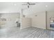 Spacious living room features sleek floors, neutral paint, recessed lighting and a dining area view at 20149 N 92Nd Ave, Peoria, AZ 85382