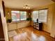 Bright breakfast nook featuring built-in cabinets, natural light, and hardwood floors at 2537 E Hazelwood St, Phoenix, AZ 85016