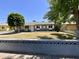 Charming single-story home with a well-maintained lawn and a decorative retaining wall at 2537 E Hazelwood St, Phoenix, AZ 85016