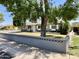 Charming single-story home with a well-maintained lawn and a decorative retaining wall at 2537 E Hazelwood St, Phoenix, AZ 85016