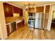 Well-lit kitchen with stainless appliances, plentiful cabinets, and functional layout at 2537 E Hazelwood St, Phoenix, AZ 85016