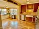 Bright kitchen featuring stainless appliances, adjacent dining area, and hardwood floors at 2537 E Hazelwood St, Phoenix, AZ 85016
