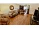 Comfortable living room with wood floors, a view of the dining room, and cozy furnishings at 2537 E Hazelwood St, Phoenix, AZ 85016