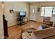 Inviting living room with hardwood floors, a front door, and a relaxing atmosphere at 2537 E Hazelwood St, Phoenix, AZ 85016