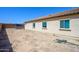 Large backyard with potential for landscaping and outdoor activities, and a partial view of the house at 25951 W Piute Ave, Buckeye, AZ 85396