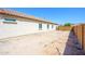 Spacious backyard featuring desert landscaping with block wall, offering privacy at 25951 W Piute Ave, Buckeye, AZ 85396