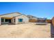 Large backyard with chain link fence and trampoline, perfect for outdoor entertainment at 25951 W Piute Ave, Buckeye, AZ 85396