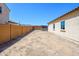 Large backyard with block wall, providing privacy and space for outdoor activities at 25951 W Piute Ave, Buckeye, AZ 85396