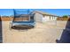 Spacious backyard featuring a trampoline, with potential for landscaping and outdoor activities at 25951 W Piute Ave, Buckeye, AZ 85396