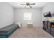 room with carpeting, a ceiling fan, and toys neatly organized on shelves at 25951 W Piute Ave, Buckeye, AZ 85396