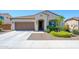 Charming single story home with a desert landscape and a two car garage at 25951 W Piute Ave, Buckeye, AZ 85396