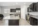 Modern kitchen with stainless steel appliances and granite countertops, perfect for cooking at 25951 W Piute Ave, Buckeye, AZ 85396