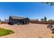 A large backyard with desert landscaping, covered patio, offering an outdoor living space at 30388 N Opal Dr, San Tan Valley, AZ 85143