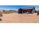A spacious backyard with desert landscaping, covered patio, perfect for outdoor entertaining or relaxation at 30388 N Opal Dr, San Tan Valley, AZ 85143
