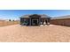 Expansive backyard featuring desert landscaping, a covered patio, and ample space for outdoor activities at 30388 N Opal Dr, San Tan Valley, AZ 85143