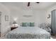 Bright bedroom featuring a white bed frame and comfortable armchair with decorations at 30388 N Opal Dr, San Tan Valley, AZ 85143