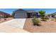 Charming single-story home featuring a two-car garage and low-maintenance desert landscaping at 30388 N Opal Dr, San Tan Valley, AZ 85143