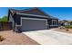 Well-maintained single-story home featuring a convenient two-car garage and water-wise desert landscaping at 30388 N Opal Dr, San Tan Valley, AZ 85143