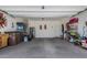Spacious garage, offering ample storage with shelving units, and plenty of open floor space at 30388 N Opal Dr, San Tan Valley, AZ 85143