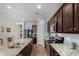 Kitchen featuring stainless steel appliances, granite countertops and wood flooring at 30388 N Opal Dr, San Tan Valley, AZ 85143