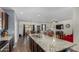 Spacious kitchen island with granite countertop overlooks living and dining areas at 30388 N Opal Dr, San Tan Valley, AZ 85143
