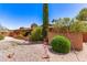 Attractive home with brick accents, mature greenery, and a well-maintained yard at 3131 E Las Rocas Dr, Phoenix, AZ 85028