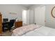 Cozy bedroom featuring closet and built in cabinet space at 3331 N Acacia Way, Buckeye, AZ 85396