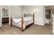 Cozy bedroom featuring neutral walls, sconce lighting, and plush carpeting at 3331 N Acacia Way, Buckeye, AZ 85396
