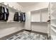 Bright walk-in closet with custom shelving and storage at 3331 N Acacia Way, Buckeye, AZ 85396
