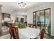 Dining room adjacent to kitchen and sliding doors leading to outdoor area at 3331 N Acacia Way, Buckeye, AZ 85396
