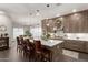 Kitchen boasts a large island, pendant lighting, and stainless steel appliances at 3331 N Acacia Way, Buckeye, AZ 85396