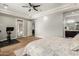 Bright main bedroom features wood floors, tray ceiling, and backyard access at 3331 N Acacia Way, Buckeye, AZ 85396