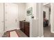 Functional mudroom featuring built-in cabinets, and access to the laundry room at 3331 N Acacia Way, Buckeye, AZ 85396