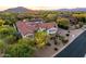 Elevated aerial showing the layout of the house, landscaping, and surrounding area at 35556 N 87Th Pl, Scottsdale, AZ 85266