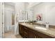 Spacious bathroom featuring double sinks, granite countertops, and separate tub and shower at 35556 N 87Th Pl, Scottsdale, AZ 85266